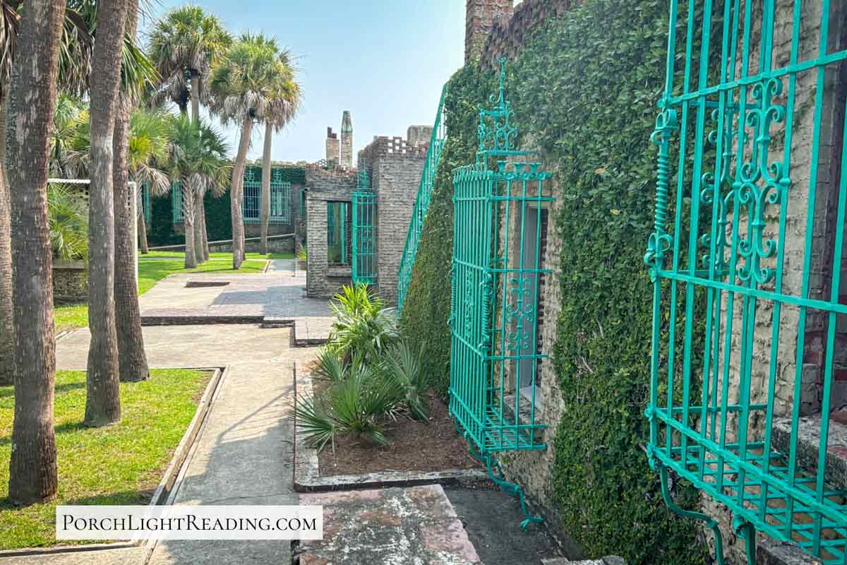 Teal covered bars over the windows at Atalaya Castle at Huntington Beach. 