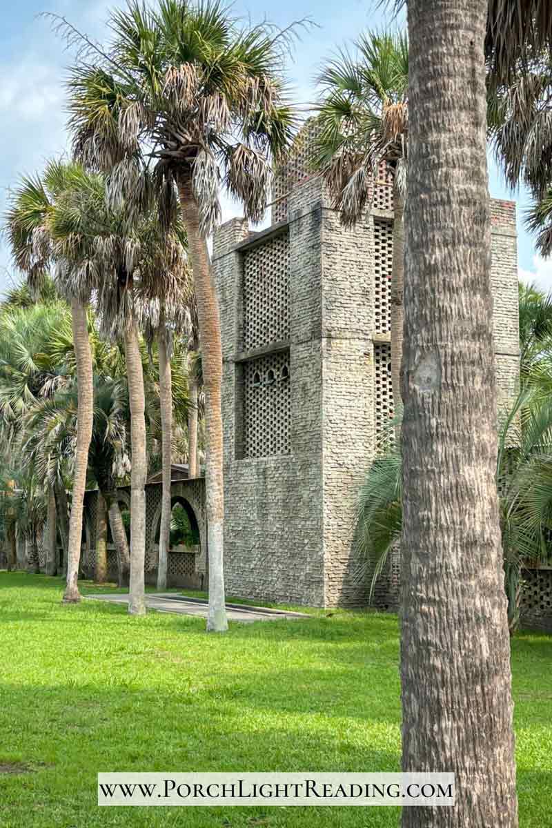 Water tower and tall palm trees inside the courtyard. 