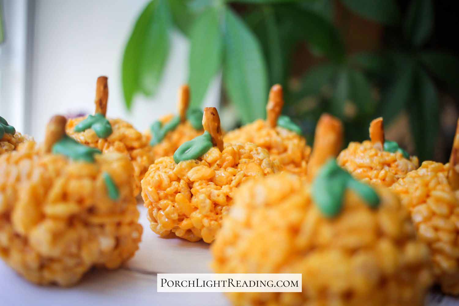 Orange pumpkin treats lined up in the kitchen.
