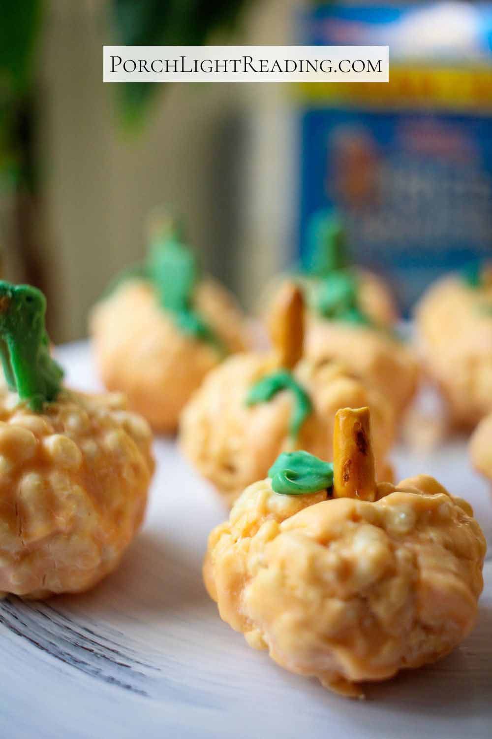 Fall shaped Rice Krispies that are dipped in orange colored white chocolate.