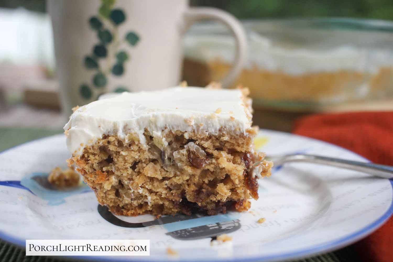 Banana cake on a blue and white plate, served with coffee.