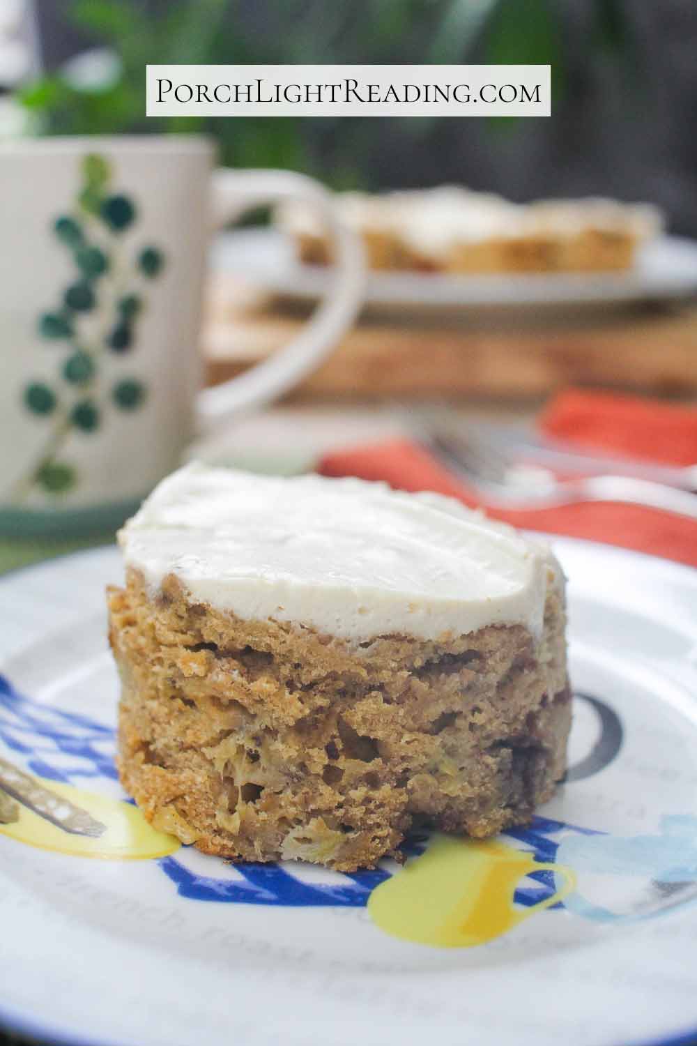 Round mini banana snack cake with Cream cheese Greek yogurt frosting. Served with coffee.