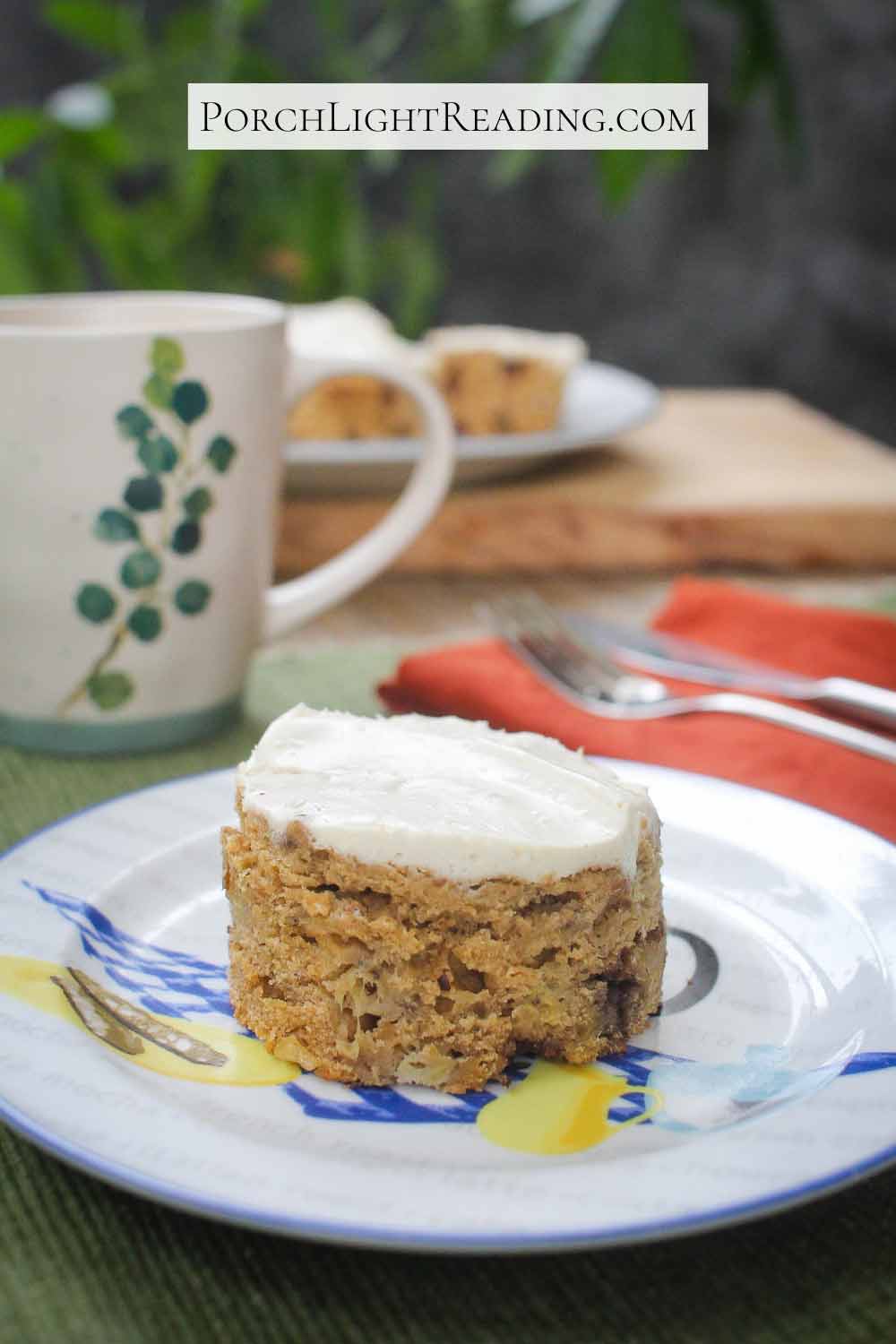 Banana sheet cake cut into a mini decorative cake and topped with cream cheese Greek Yogurt frosting.