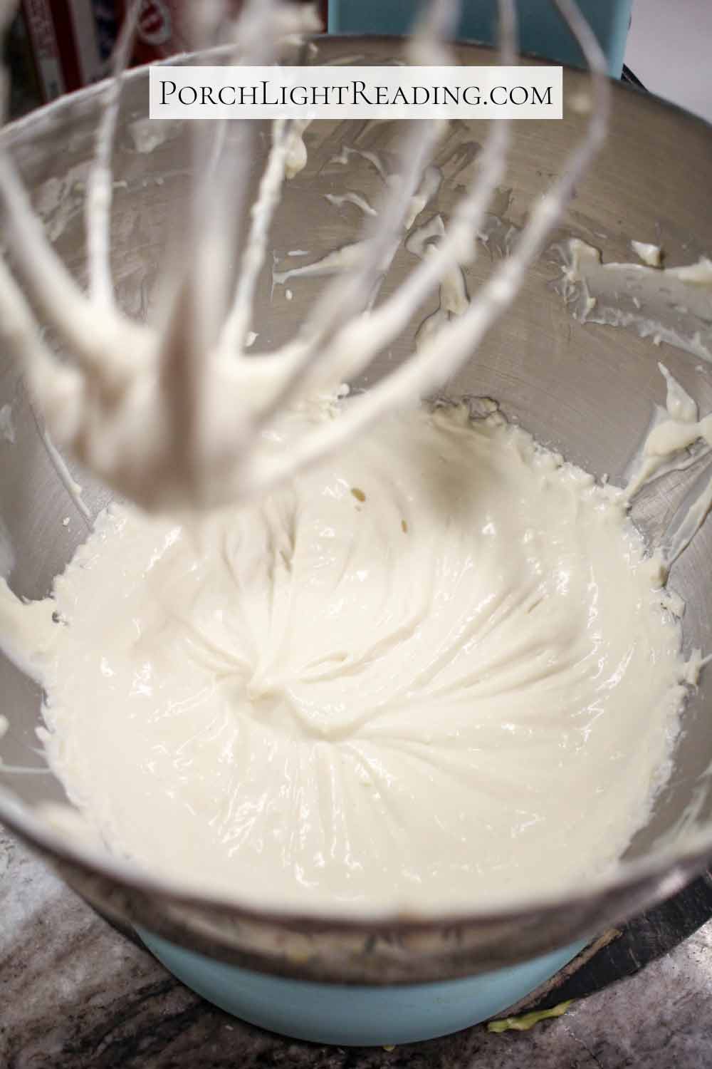 Cream cheese Greek yogurt frosting mixed smooth with a kitchen mixer.