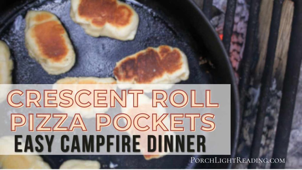 Crescent roll pizza pockets cooking over a campfire.