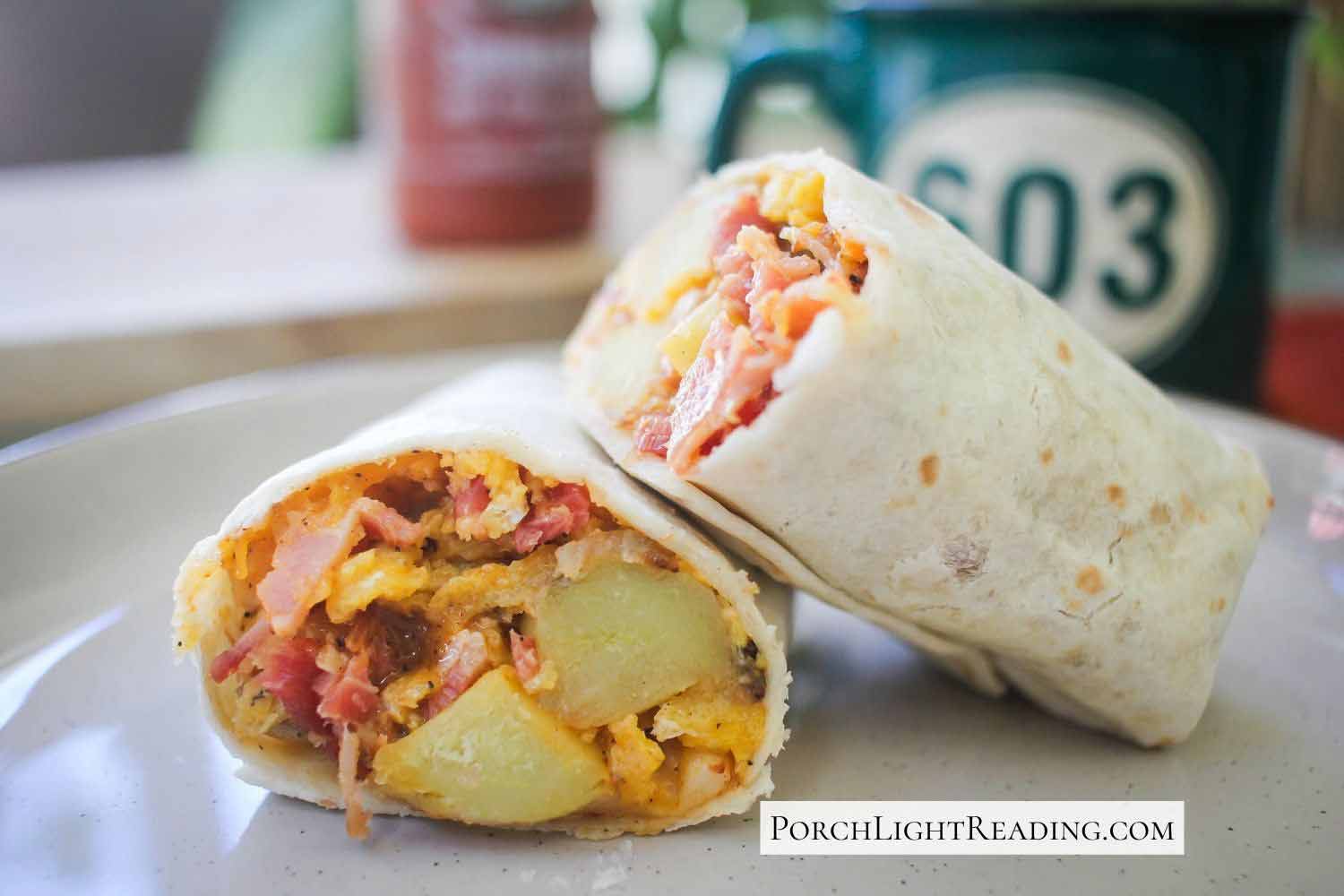 Generously filled burrito with potatoes, eggs, bacon, and cheese. Served with coffee and hot sauce topping.