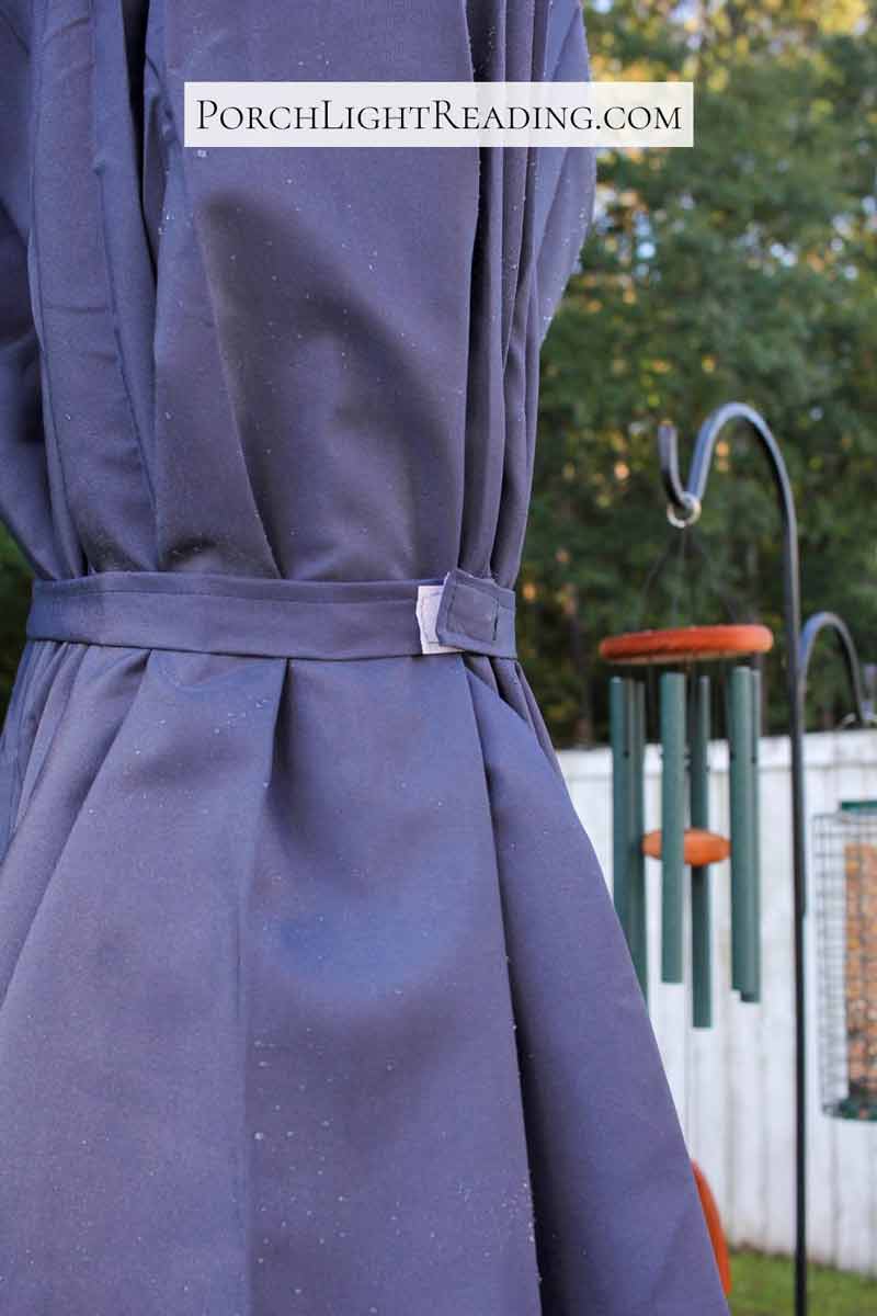 Outdoor umbrella with velcro strap.