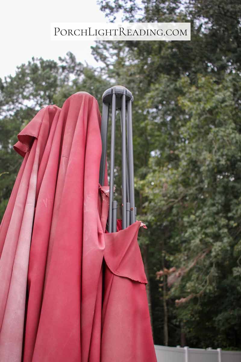 15 foot umbrella and frame with ripped canopy.